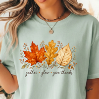 Load image into Gallery viewer, Comfort Colors Fall Leaves Shirt, Gather Glow Give Thanks Tee, Watercolor Autumn Leaf T-Shirt, Thanksgiving Graphic Tee, Sage Green Cozy Fall Gift for Her, Aesthetic Botanical Harvest Tee